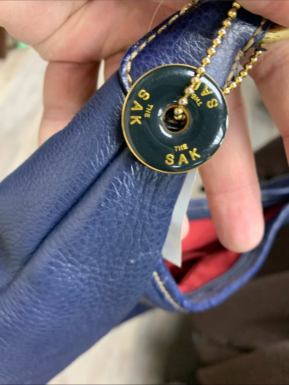 The Sak Navy Leather Shoulder Bag with Red Lining
